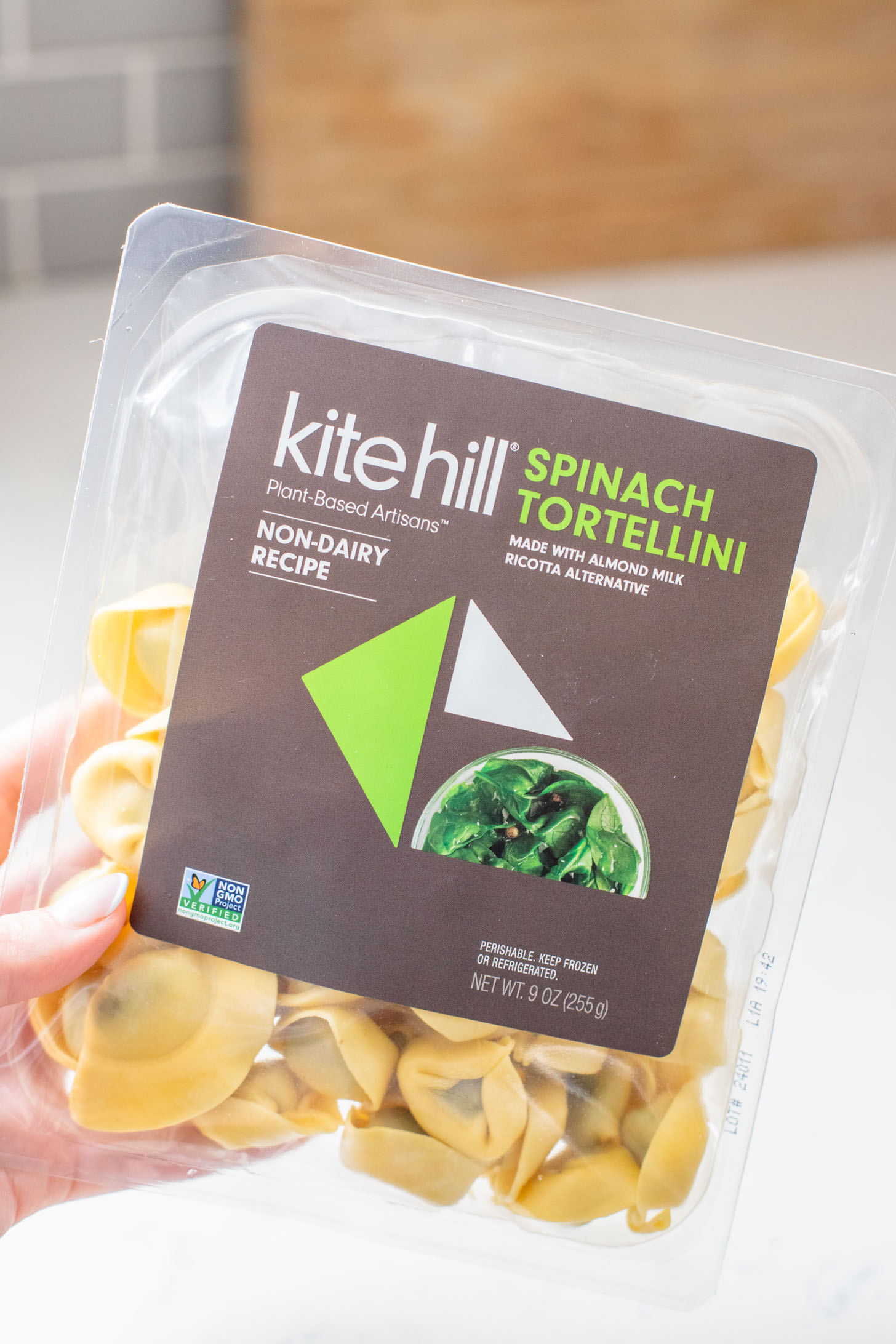 This Pesto Tortellini Pasta Salad is made with a vegan red pepper pesto, tomatoes & arugula. A great vegan side dish for a BBQ | ThisSavoryVegan.com