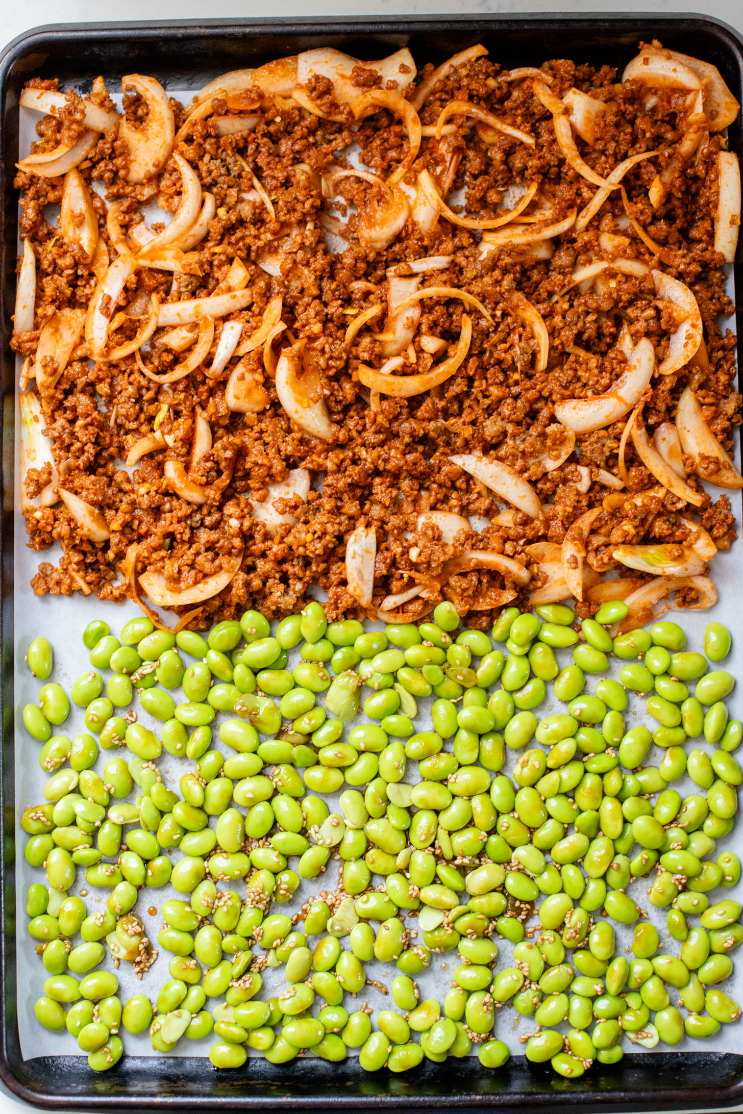 This Sheet Pan Red Curry Vegan Beef is the perfect weeknight dinner! Served with coconut rice, crispy edamame and spicy peanut sauce | ThisSavoryVegan.com