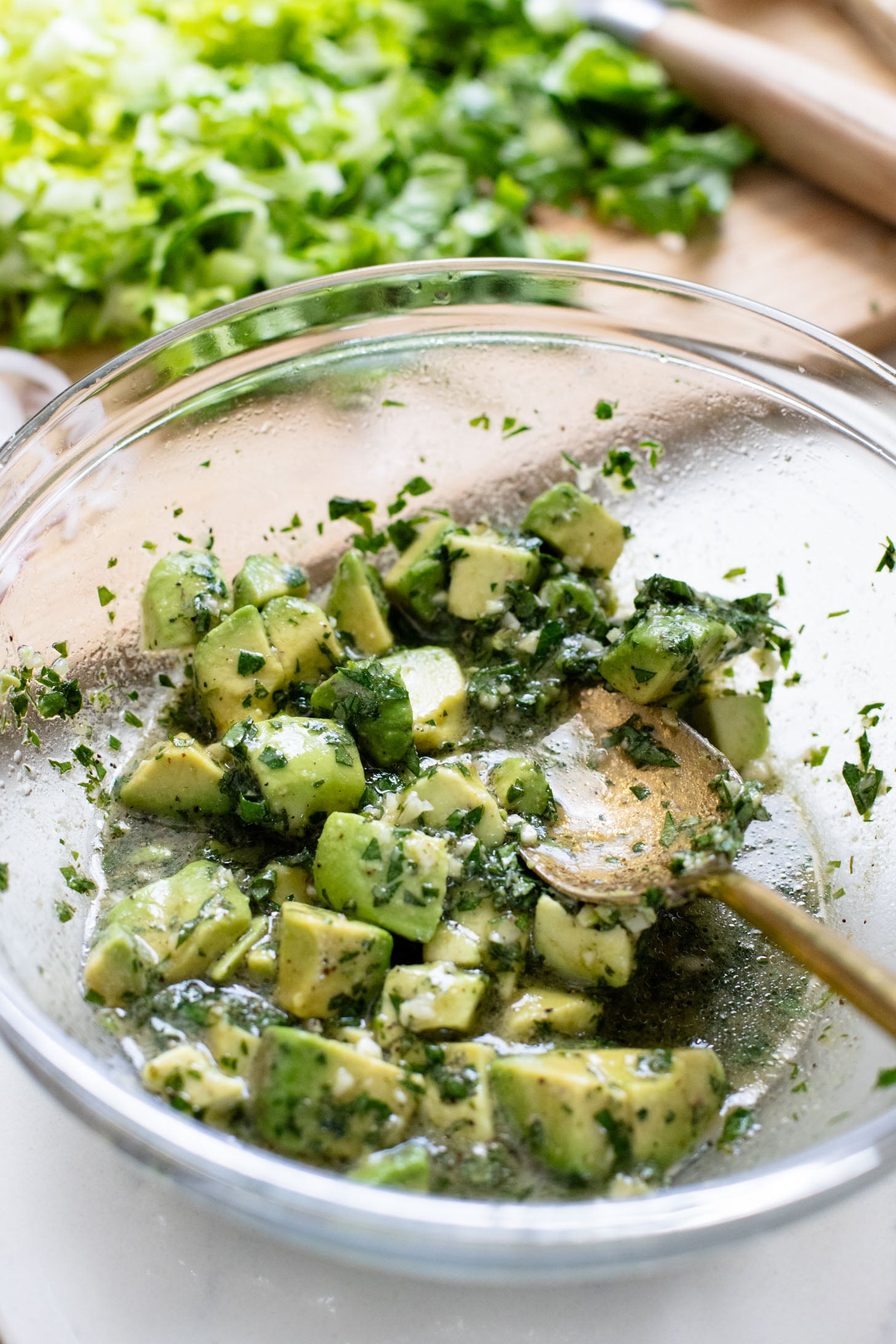 These Sheet Pan Vegan Harissa Meatballs are a high protein vegan meal idea. Served with roasted zucchini, chickpeas and avocado dressing | ThisSavoryVegan.com