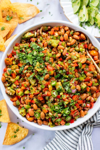 This Simple Pinto Bean Salad is a mix of canned beans, crunchy veggies, avocado chunks and a chipotle chili lime dressing | ThisSavoryVegan.com