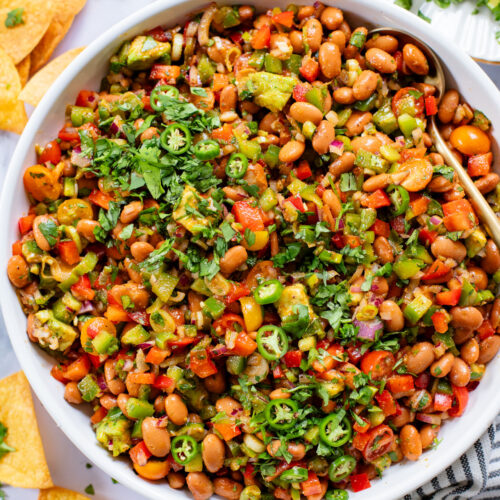 This Simple Pinto Bean Salad is a mix of canned beans, crunchy veggies, avocado chunks and a chipotle chili lime dressing | ThisSavoryVegan.com