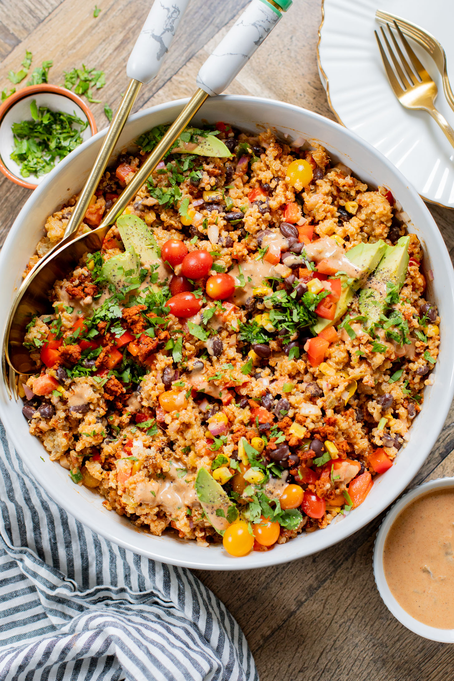 This Southwest Quinoa Salad is perfect for meal prep or a party. Packed with plant protein, plenty of veggies and a creamy sauce | ThisSavoryVegan.com