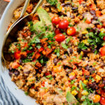 This Southwest Quinoa Salad is perfect for meal prep or a party. Packed with plant protein, plenty of veggies and a creamy sauce | ThisSavoryVegan.com