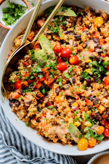 This Southwest Quinoa Salad is perfect for meal prep or a party. Packed with plant protein, plenty of veggies and a creamy sauce | ThisSavoryVegan.com