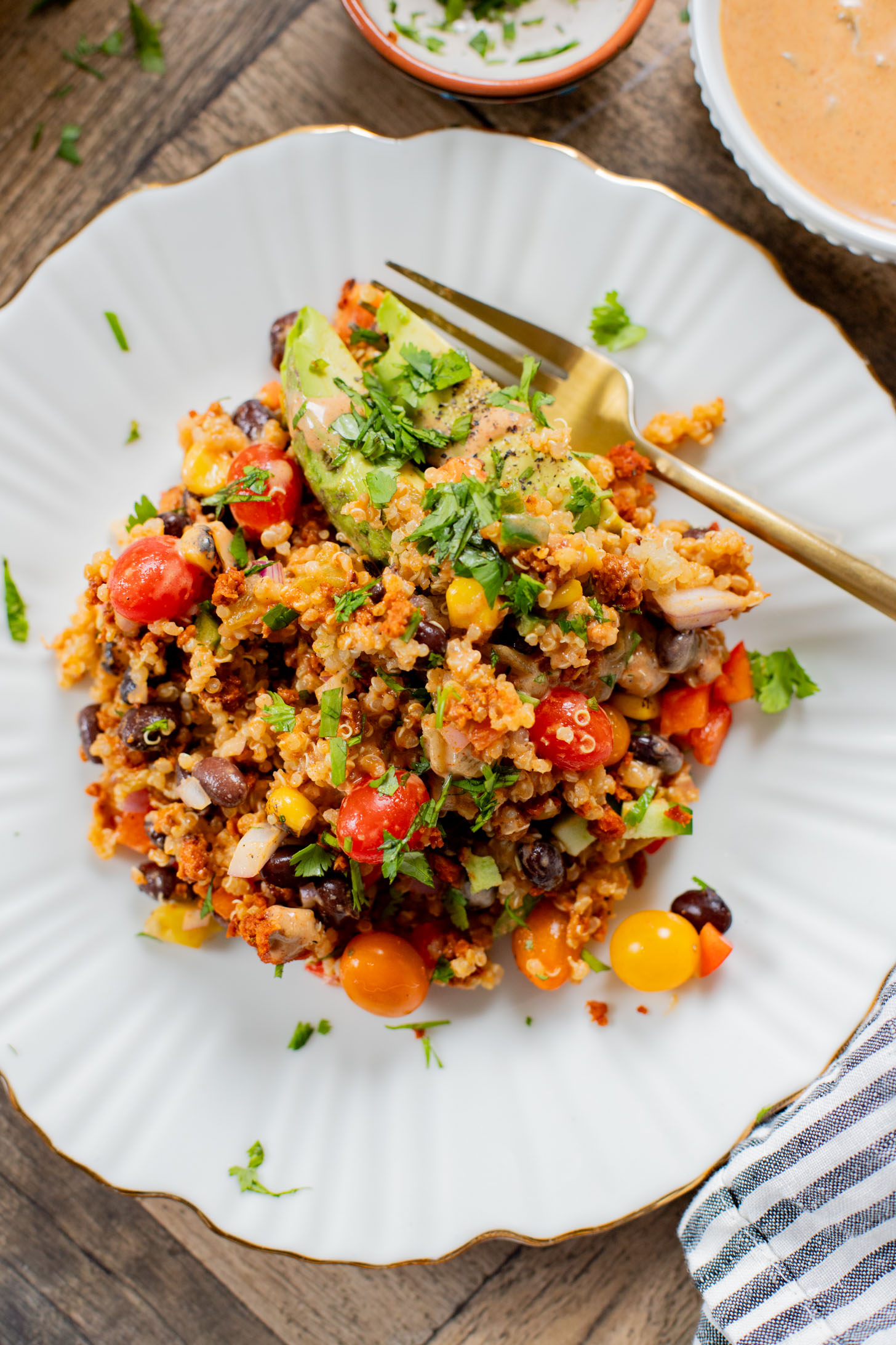 This Southwest Quinoa Salad is perfect for meal prep or a party. Packed with plant protein, plenty of veggies and a creamy sauce | ThisSavoryVegan.com