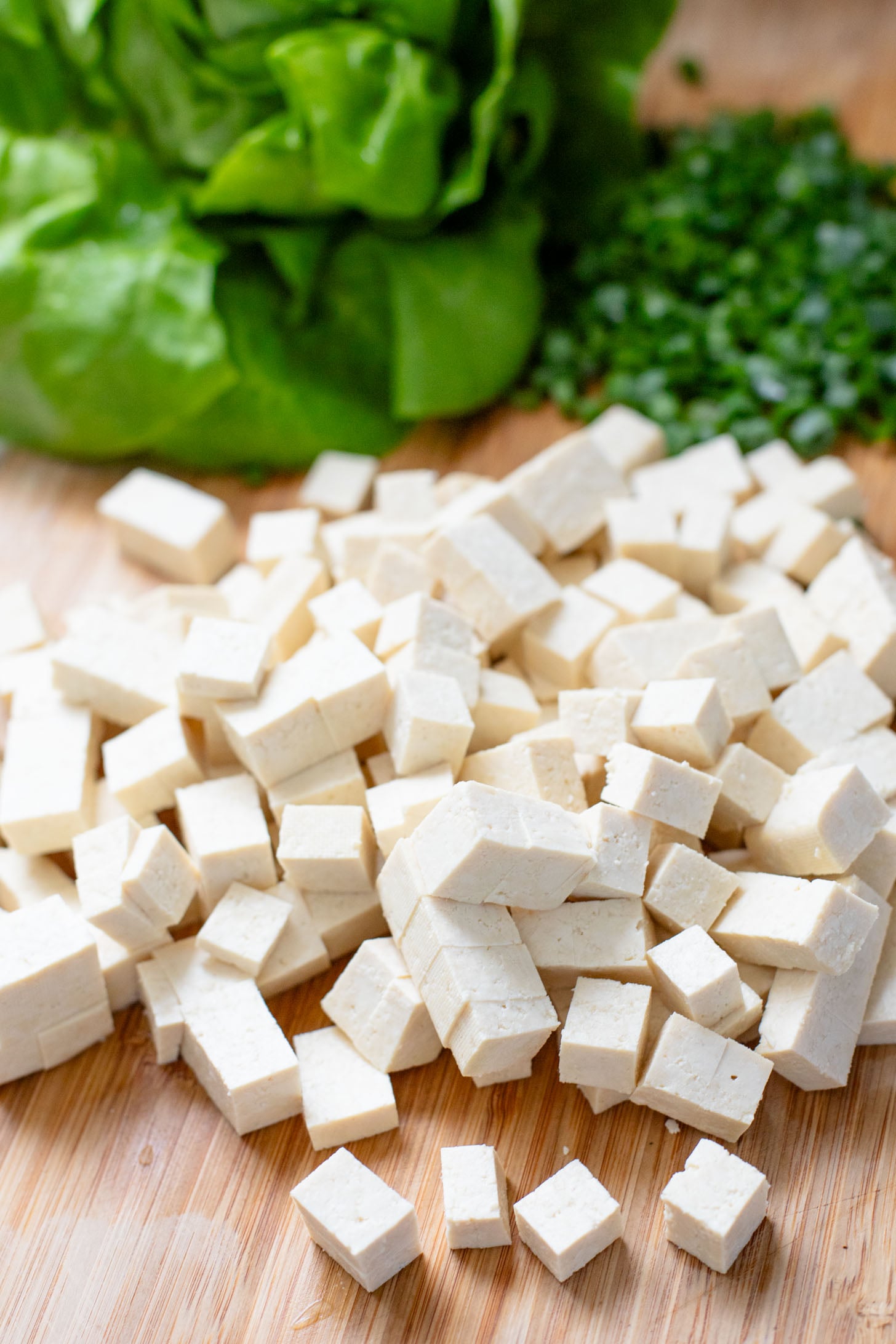 Layered with crispy peanut tofu, a spicy asian sauce and plenty of fresh herbs, these Tofu Lettuce Wraps are bright, easy and filling | ThisSavoryVegan.com