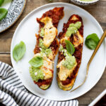These Vegan Lasagna Zucchini Boats are a low-carb, dairy-free way to enjoy your favorite lasagna flavors! Served with an oil-free pesto | ThisSavoryVegan.com