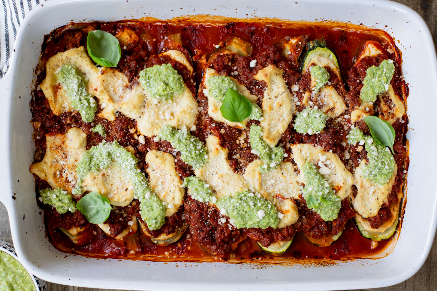 These Vegan Lasagna Zucchini Boats are a low-carb, dairy-free way to enjoy your favorite lasagna flavors! Served with an oil-free pesto | ThisSavoryVegan.com