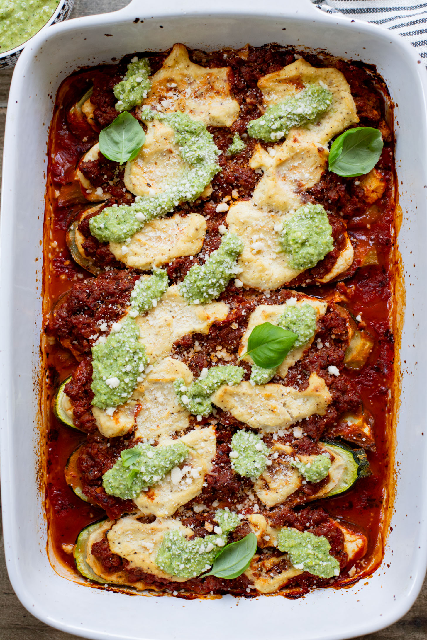 These Vegan Lasagna Zucchini Boats are a low-carb, dairy-free way to enjoy your favorite lasagna flavors! Served with an oil-free pesto | ThisSavoryVegan.com