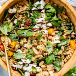 This White Bean Balsamic Pasta Salad is a summer must make! Made with vegan feta, cherry tomatoes, herbs, white beans & balsamic dressing | ThisSavoryVegan.com