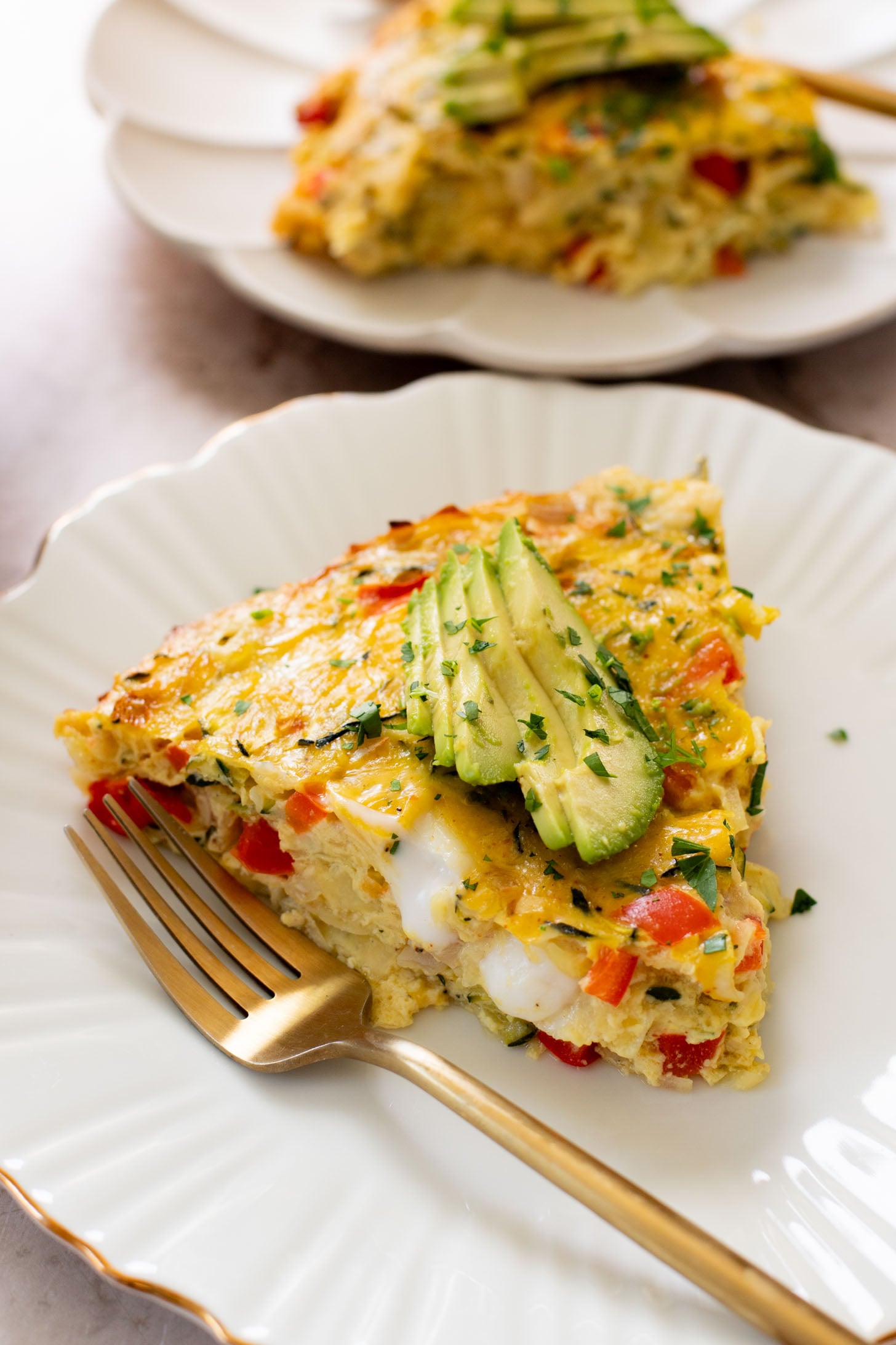 This Zucchini & Potato Vegan Egg Bake is the perfect summer brunch idea! Shredded zucchini & potatoes are baked with Just Egg | ThisSavoryVegan.com