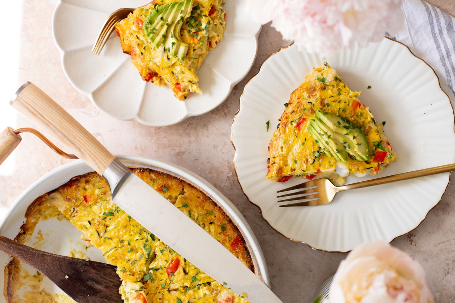 This Zucchini & Potato Vegan Egg Bake is the perfect summer brunch idea! Shredded zucchini & potatoes are baked with Just Egg | ThisSavoryVegan.com