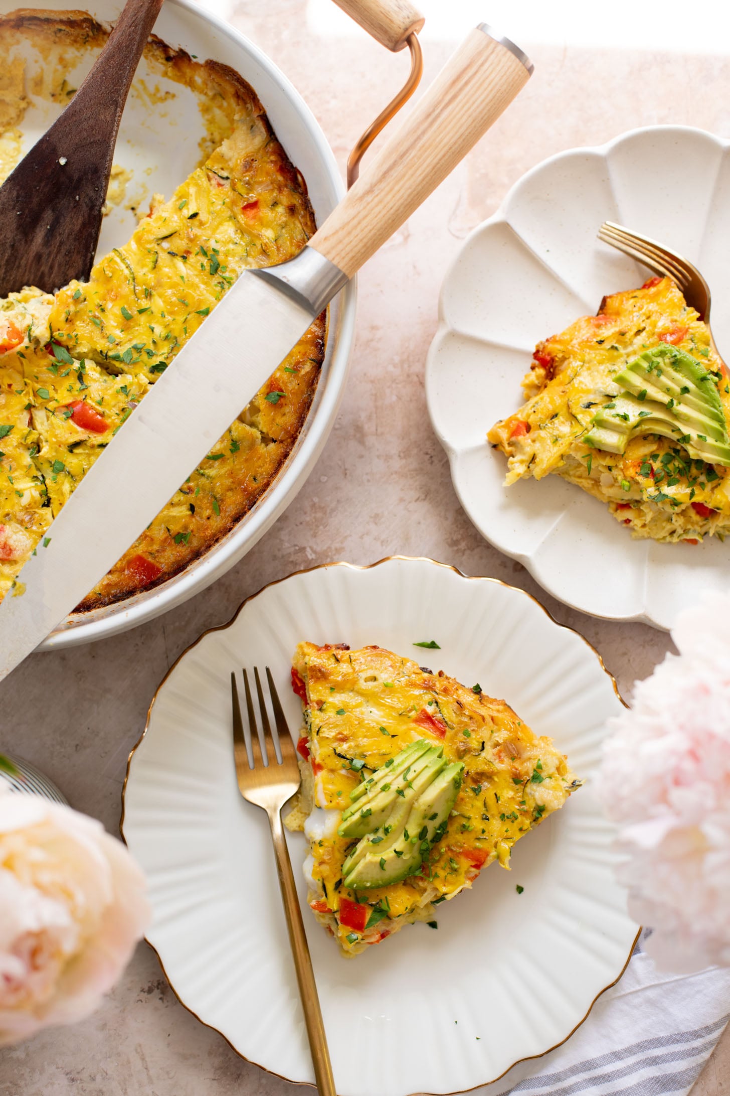 This Zucchini & Potato Vegan Egg Bake is the perfect summer brunch idea! Shredded zucchini & potatoes are baked with Just Egg | ThisSavoryVegan.com