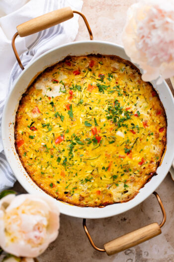 This Zucchini & Potato Vegan Egg Bake is the perfect summer brunch idea! Shredded zucchini & potatoes are baked with Just Egg | ThisSavoryVegan.com