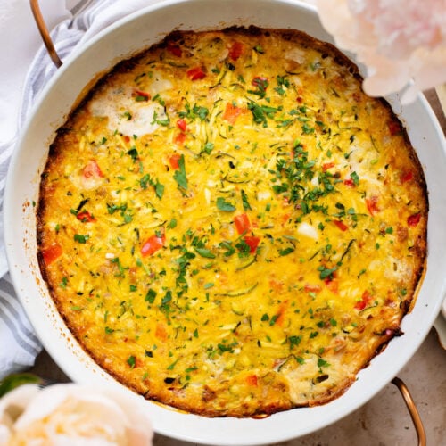 This Zucchini & Potato Vegan Egg Bake is the perfect summer brunch idea! Shredded zucchini & potatoes are baked with Just Egg | ThisSavoryVegan.com