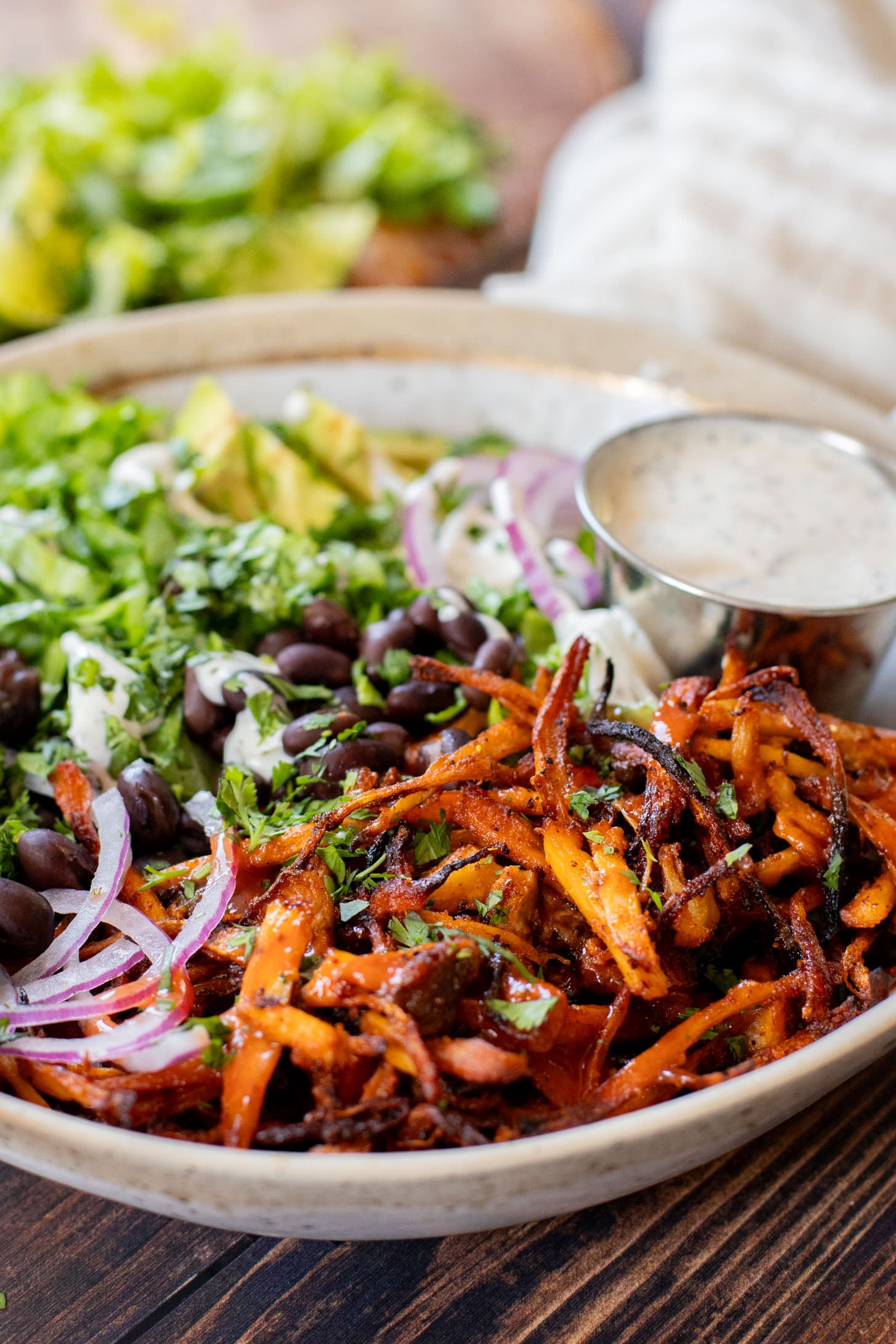 These Buffalo Oyster Mushroom Bowls are an easy vegan weeknight dinner! Layered with brown rice, black beans, crispy mushrooms & vegan ranch | ThisSavoryVegan.com