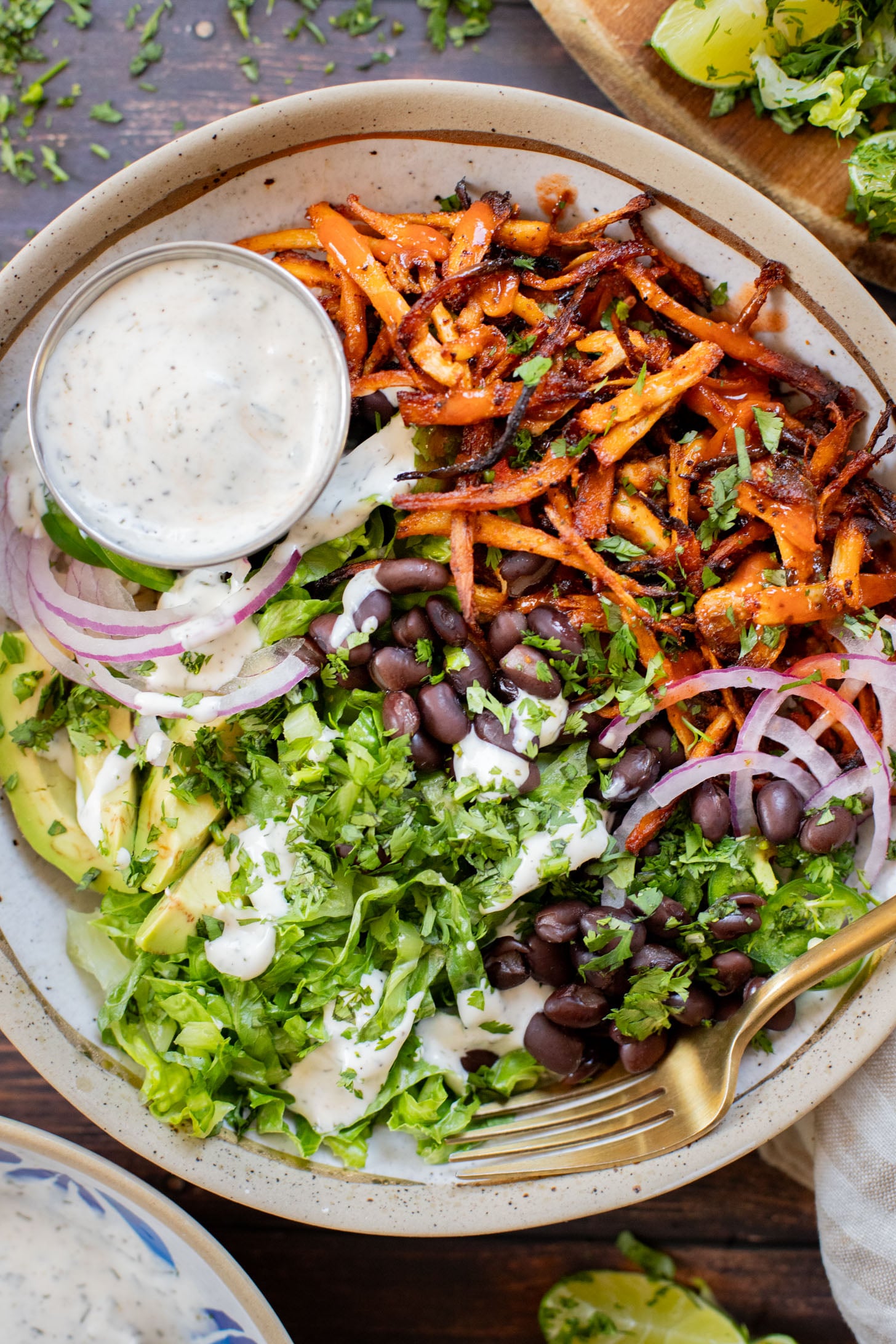 These Buffalo Oyster Mushroom Bowls are an easy vegan weeknight dinner! Layered with brown rice, black beans, crispy mushrooms & vegan ranch | ThisSavoryVegan.com
