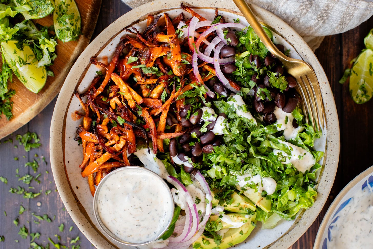 These Buffalo Oyster Mushroom Bowls are an easy vegan weeknight dinner! Layered with brown rice, black beans, crispy mushrooms & vegan ranch | ThisSavoryVegan.com