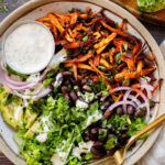 These Buffalo Oyster Mushroom Bowls are an easy vegan weeknight dinner! Layered with brown rice, black beans, crispy mushrooms & vegan ranch | ThisSavoryVegan.com