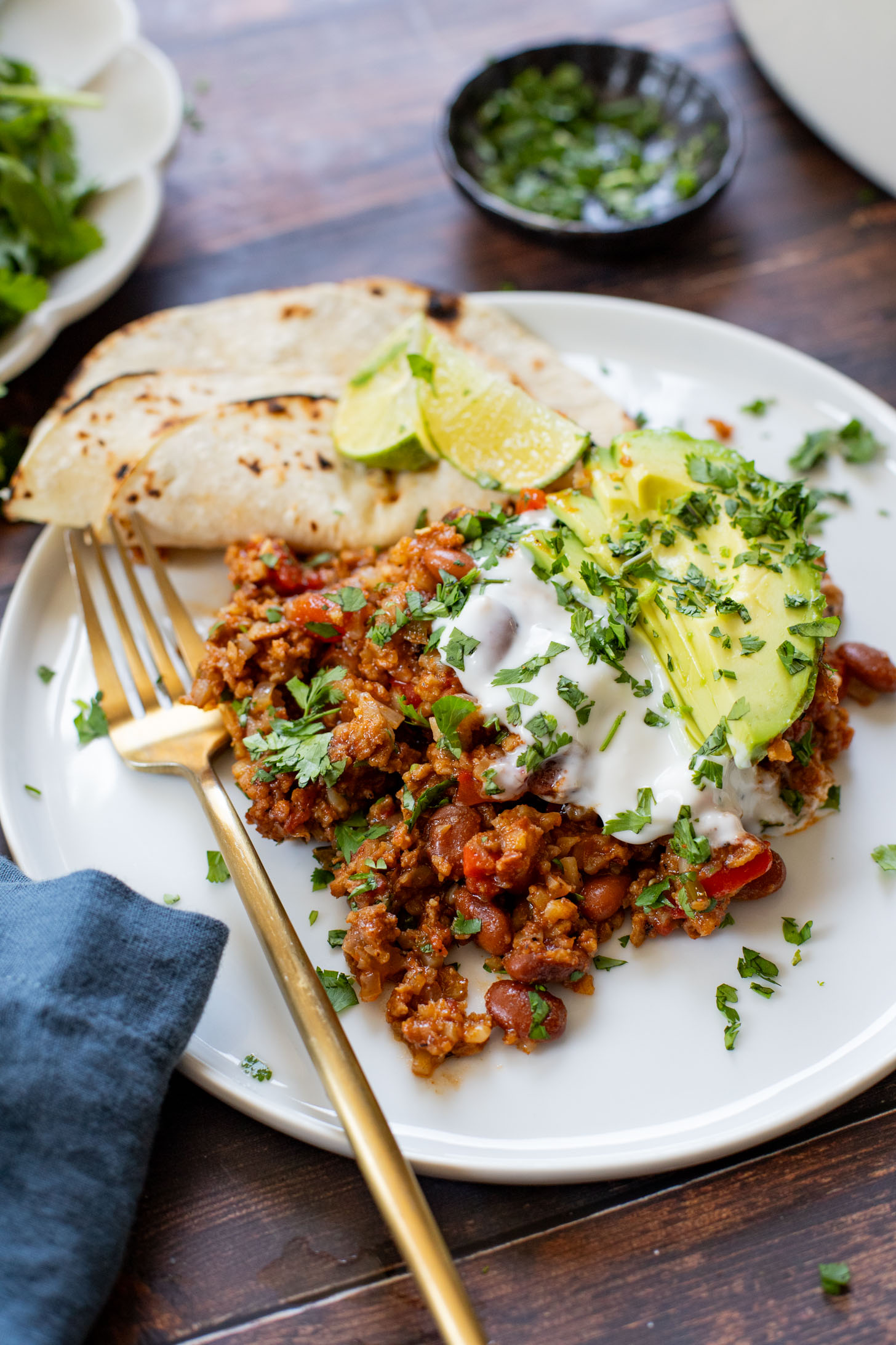 If you are in need of a low carb vegan dinner idea then you need to try this Cauliflower Rice Taco Skillet! Filled with veggies, beans & TONS of flavor | ThisSavoryVegan.com
