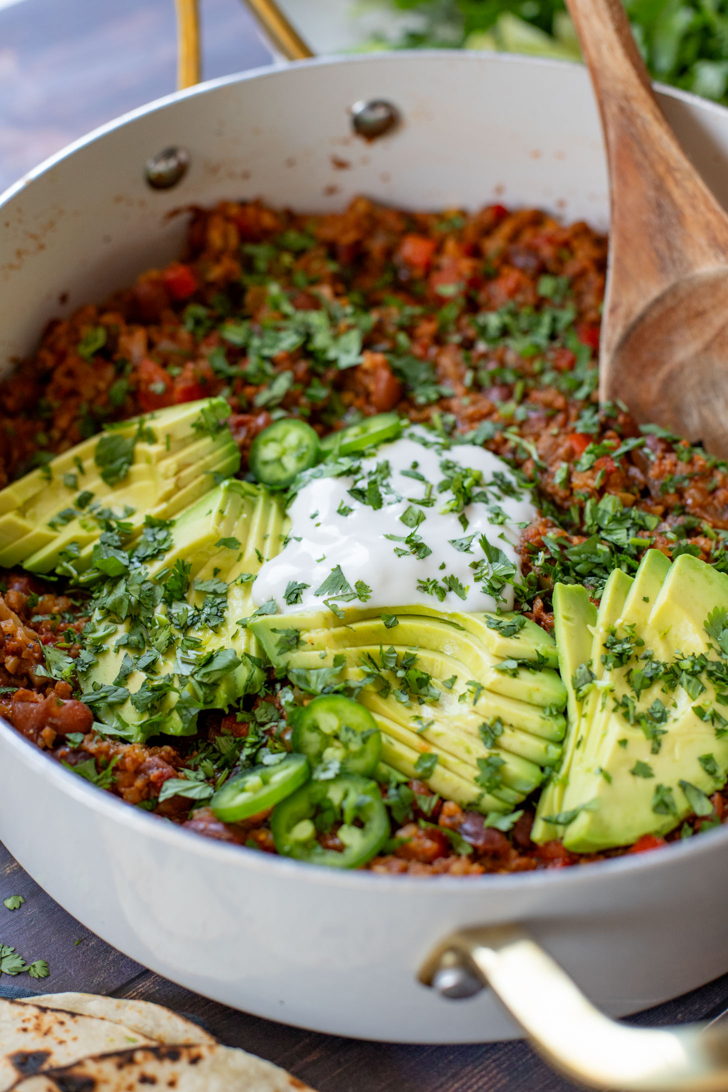 If you are in need of a low carb vegan dinner idea then you need to try this Cauliflower Rice Taco Skillet! Filled with veggies, beans & TONS of flavor | ThisSavoryVegan.com