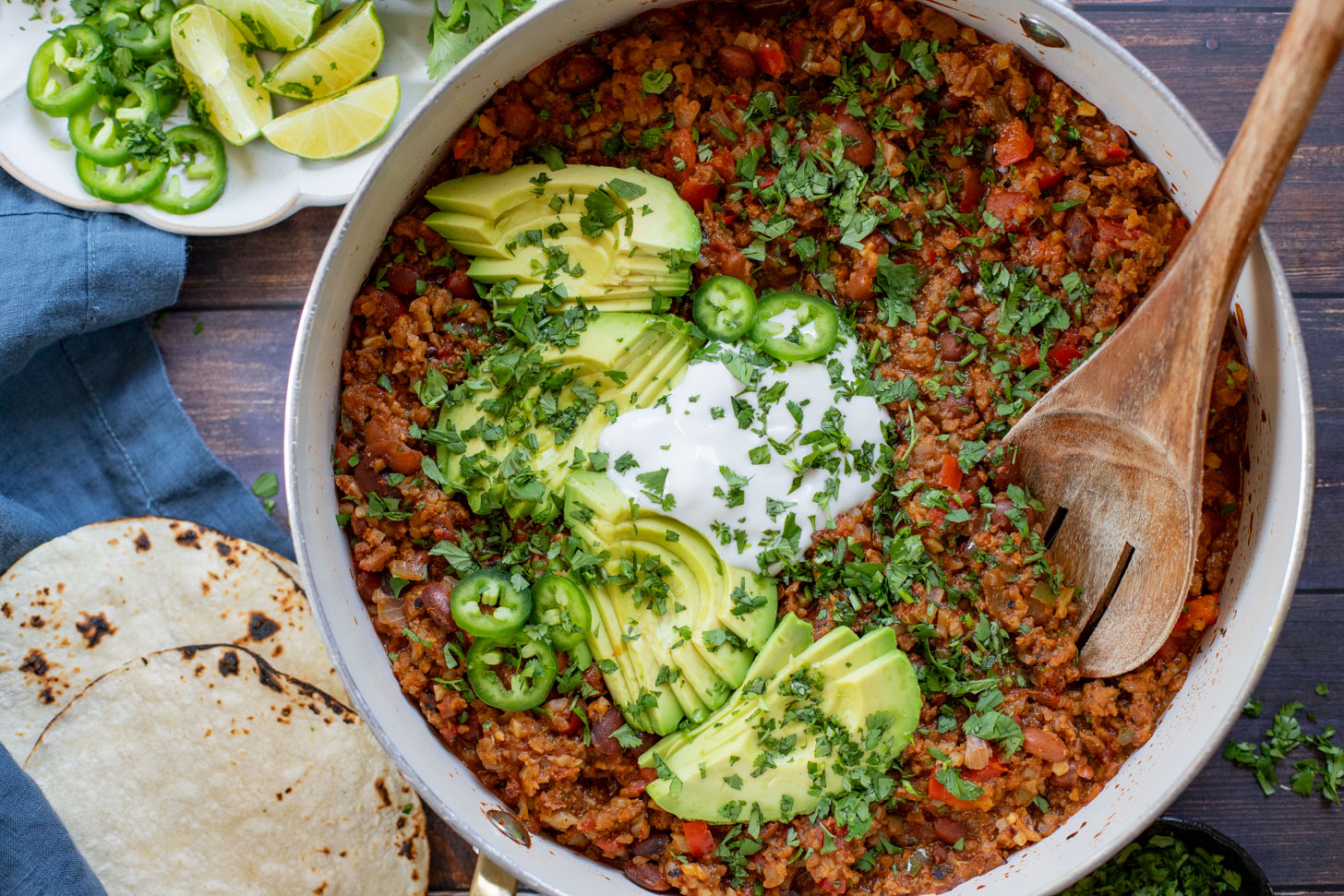 If you are in need of a low carb vegan dinner idea then you need to try this Cauliflower Rice Taco Skillet! Filled with veggies, beans & TONS of flavor | ThisSavoryVegan.com