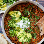 If you are in need of a low carb vegan dinner idea then you need to try this Cauliflower Rice Taco Skillet! Filled with veggies, beans & TONS of flavor | ThisSavoryVegan.com