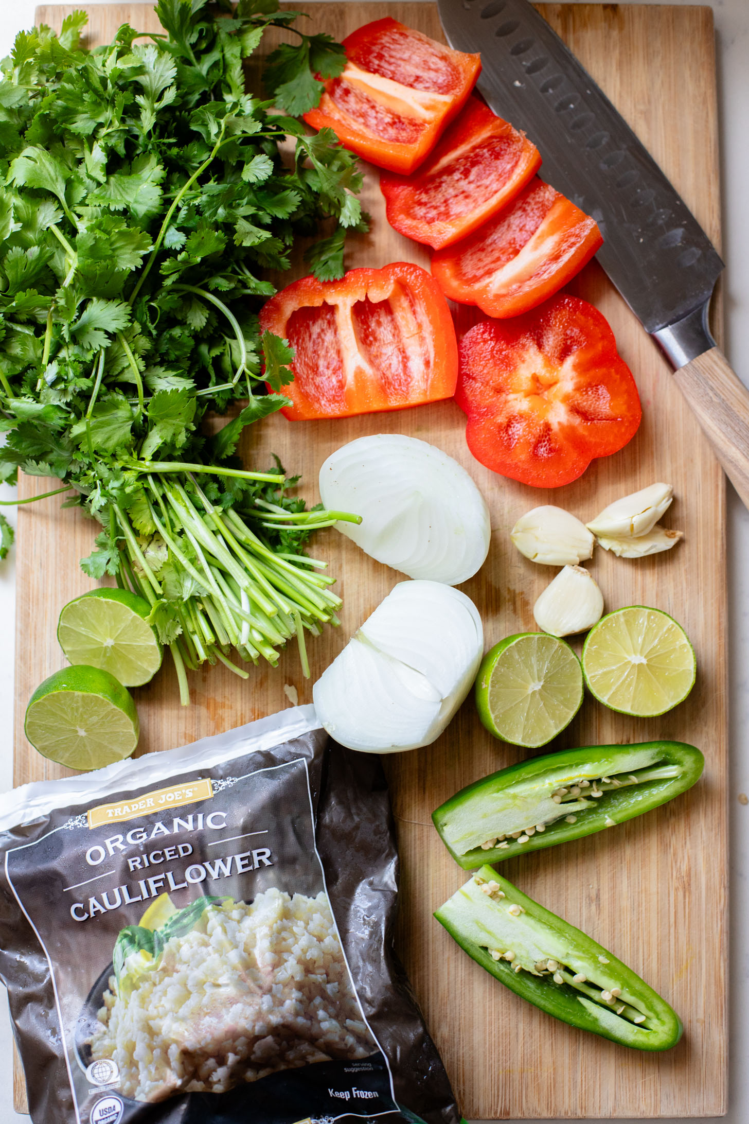 If you are in need of a low carb vegan dinner idea then you need to try this Cauliflower Rice Taco Skillet! Filled with veggies, beans & TONS of flavor | ThisSavoryVegan.com