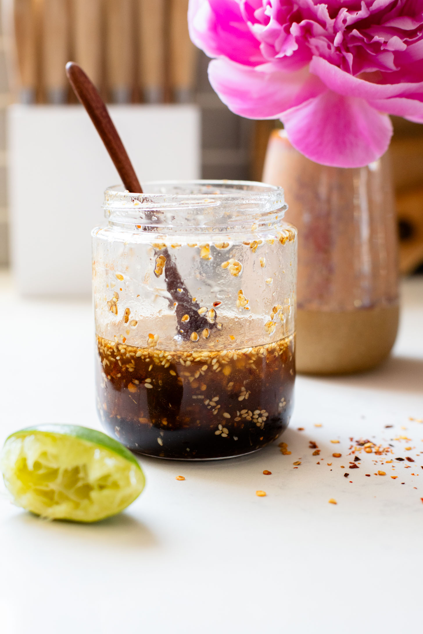 This Sesame Ginger Noodle Salad is filled with TONS of veggies, cold noodles and a super tasty homemade sesame ginger dressing | ThisSavoryVegan.com