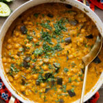 This Simple Eggplant Curry is made in one pot with a yellow curry coconut sauce, chickpeas, charred eggplant and veggies | ThisSavoryVegan.com
