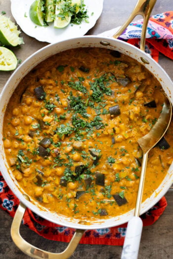 This Simple Eggplant Curry is made in one pot with a yellow curry coconut sauce, chickpeas, charred eggplant and veggies | ThisSavoryVegan.com