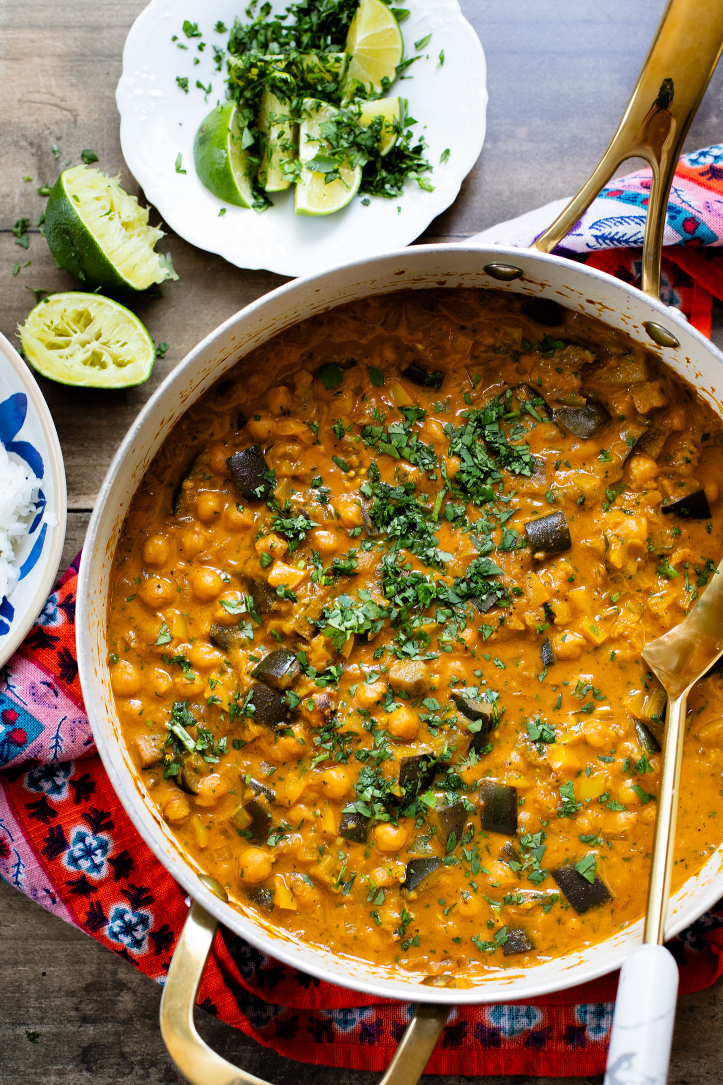 This Simple Eggplant Curry is made in one pot with a yellow curry coconut sauce, chickpeas, charred eggplant and veggies | ThisSavoryVegan.com