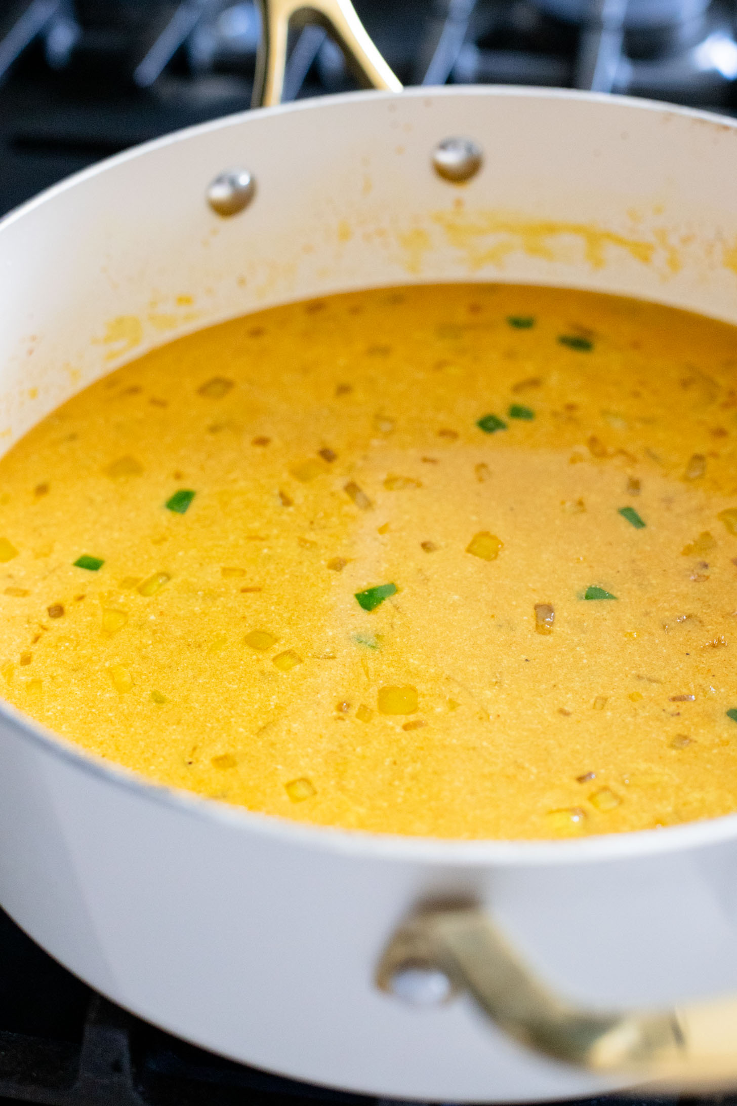 This Simple Eggplant Curry is made in one pot with a yellow curry coconut sauce, chickpeas, charred eggplant and veggies | ThisSavoryVegan.com