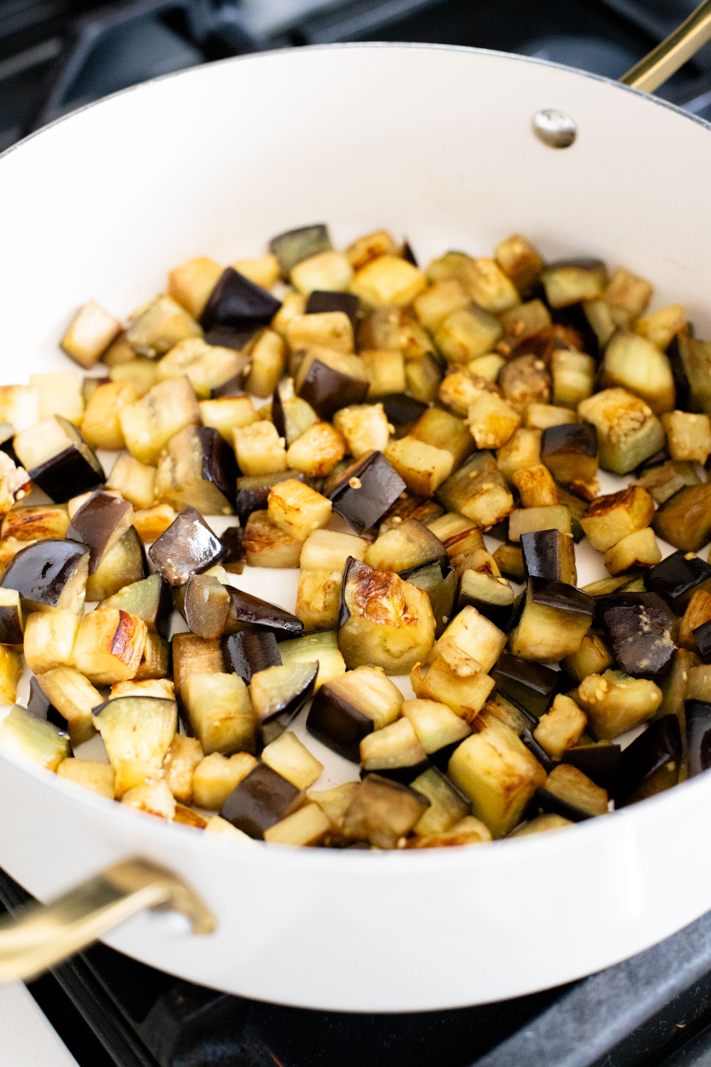This Simple Eggplant Curry is made in one pot with a yellow curry coconut sauce, chickpeas, charred eggplant and veggies | ThisSavoryVegan.com