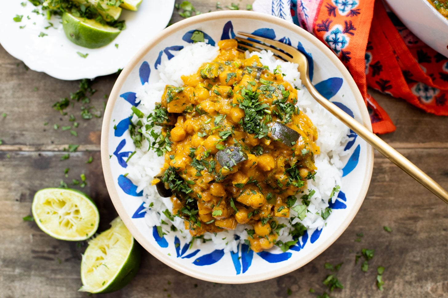 This Simple Eggplant Curry is made in one pot with a yellow curry coconut sauce, chickpeas, charred eggplant and veggies | ThisSavoryVegan.com