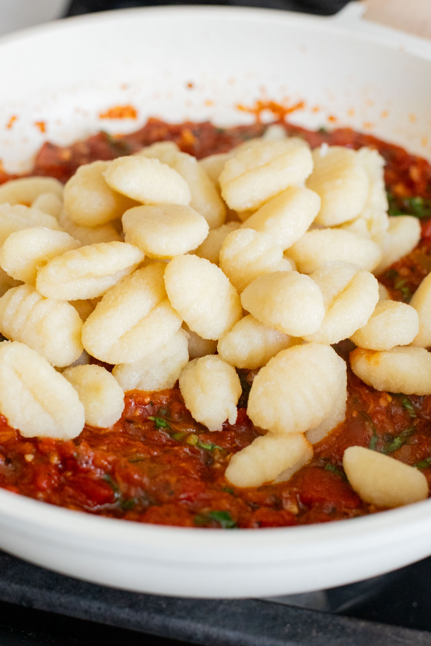 This Simple Tomato Basil Gnocchi is a rustic, 30-minute vegan dinner recipe that everyone will enjoy. Simple, delicious & easy | ThisSavoryVegan.com