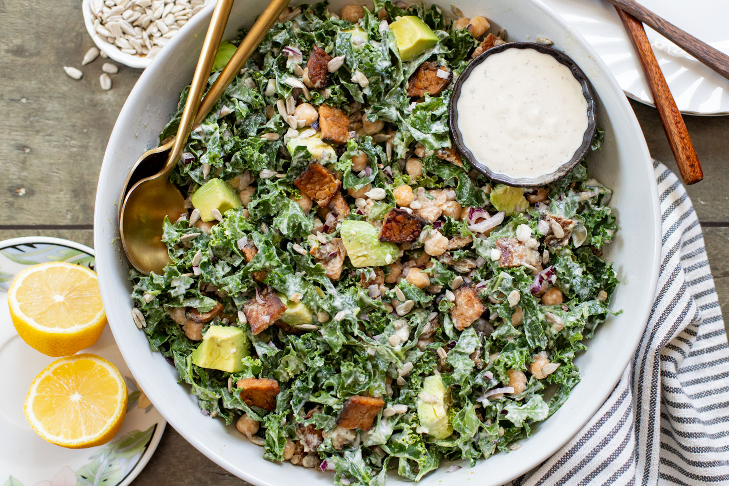 Healthy & delicious, this Tempeh Bacon Kale Salad is a vegan dream! Made with crispy tempeh bacon, chickpeas, avocado & lemon tahini dressing | ThisSavoryVegan.com