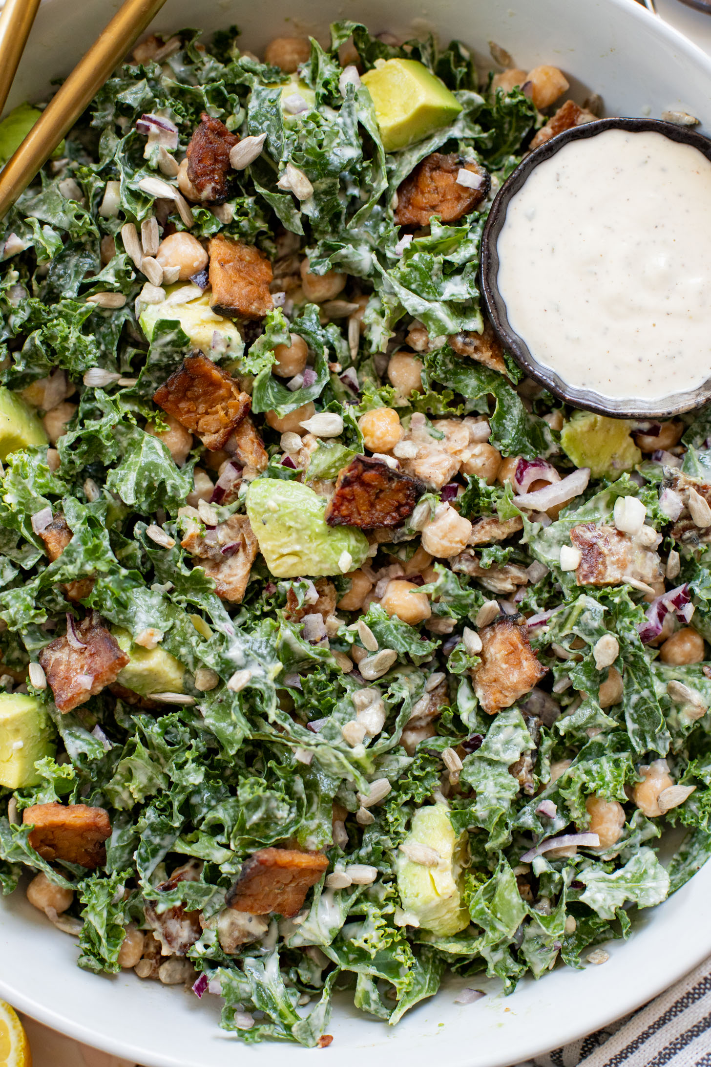 Healthy & delicious, this Tempeh Bacon Kale Salad is a vegan dream! Made with crispy tempeh bacon, chickpeas, avocado & lemon tahini dressing | ThisSavoryVegan.com