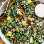 Healthy & delicious, this Tempeh Bacon Kale Salad is a vegan dream! Made with crispy tempeh bacon, chickpeas, avocado & lemon tahini dressing | ThisSavoryVegan.com