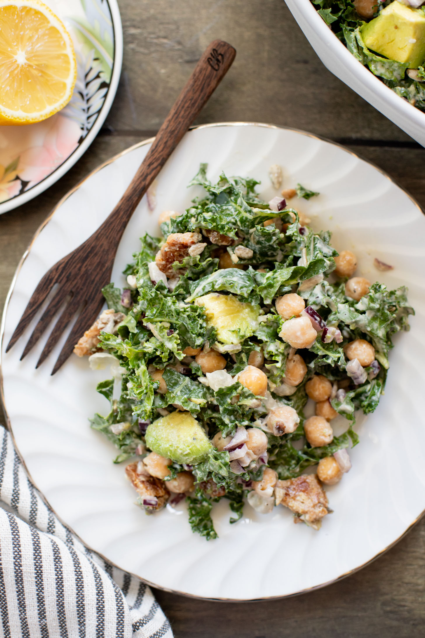 Healthy & delicious, this Tempeh Bacon Kale Salad is a vegan dream! Made with crispy tempeh bacon, chickpeas, avocado & lemon tahini dressing | ThisSavoryVegan.com