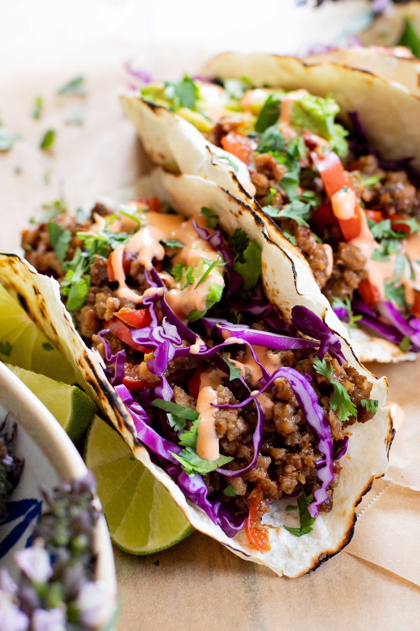 These Vegan Thai Beef Tacos are an explosion of flavor - filled with soy "beef" crumbles in a Thai-inspired sauce, spicy mayo, avocado & cabbage | ThisSavoryVegan.com