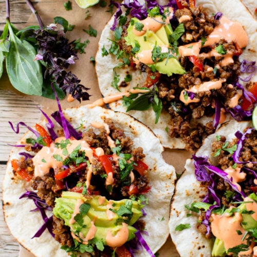These Vegan Thai Beef Tacos are an explosion of flavor - filled with soy "beef" crumbles in a Thai-inspired sauce, spicy mayo, avocado & cabbage | ThisSavoryVegan.com