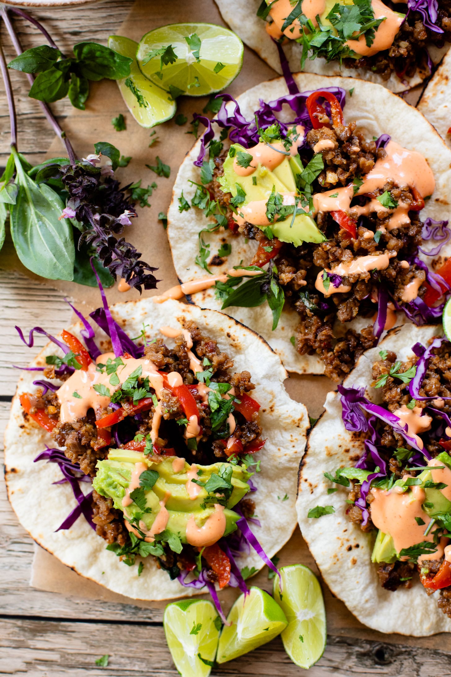 These Vegan Thai Beef Tacos are an explosion of flavor - filled with soy "beef" crumbles in a Thai-inspired sauce, spicy mayo, avocado & cabbage | ThisSavoryVegan.com