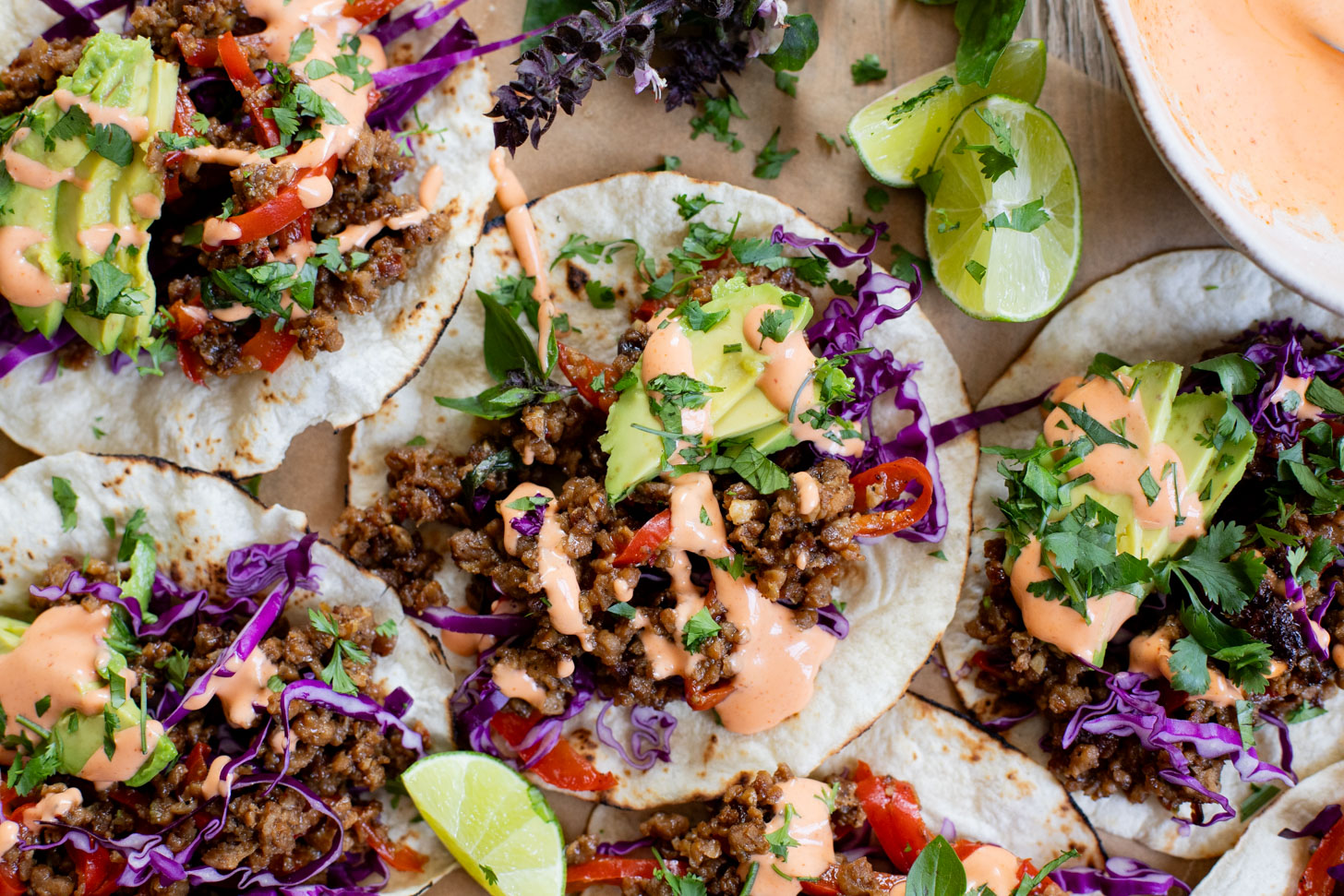 These Vegan Thai Beef Tacos are an explosion of flavor - filled with soy "beef" crumbles in a Thai-inspired sauce, spicy mayo, avocado & cabbage | ThisSavoryVegan.com