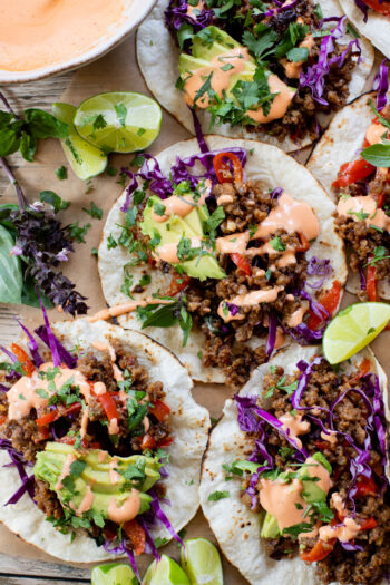 These Vegan Thai Beef Tacos are an explosion of flavor - filled with soy "beef" crumbles in a Thai-inspired sauce, spicy mayo, avocado & cabbage | ThisSavoryVegan.com
