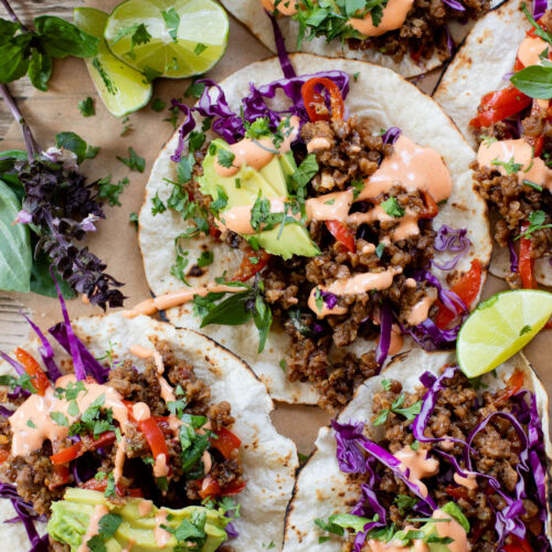 These Vegan Thai Beef Tacos are an explosion of flavor - filled with soy "beef" crumbles in a Thai-inspired sauce, spicy mayo, avocado & cabbage | ThisSavoryVegan.com
