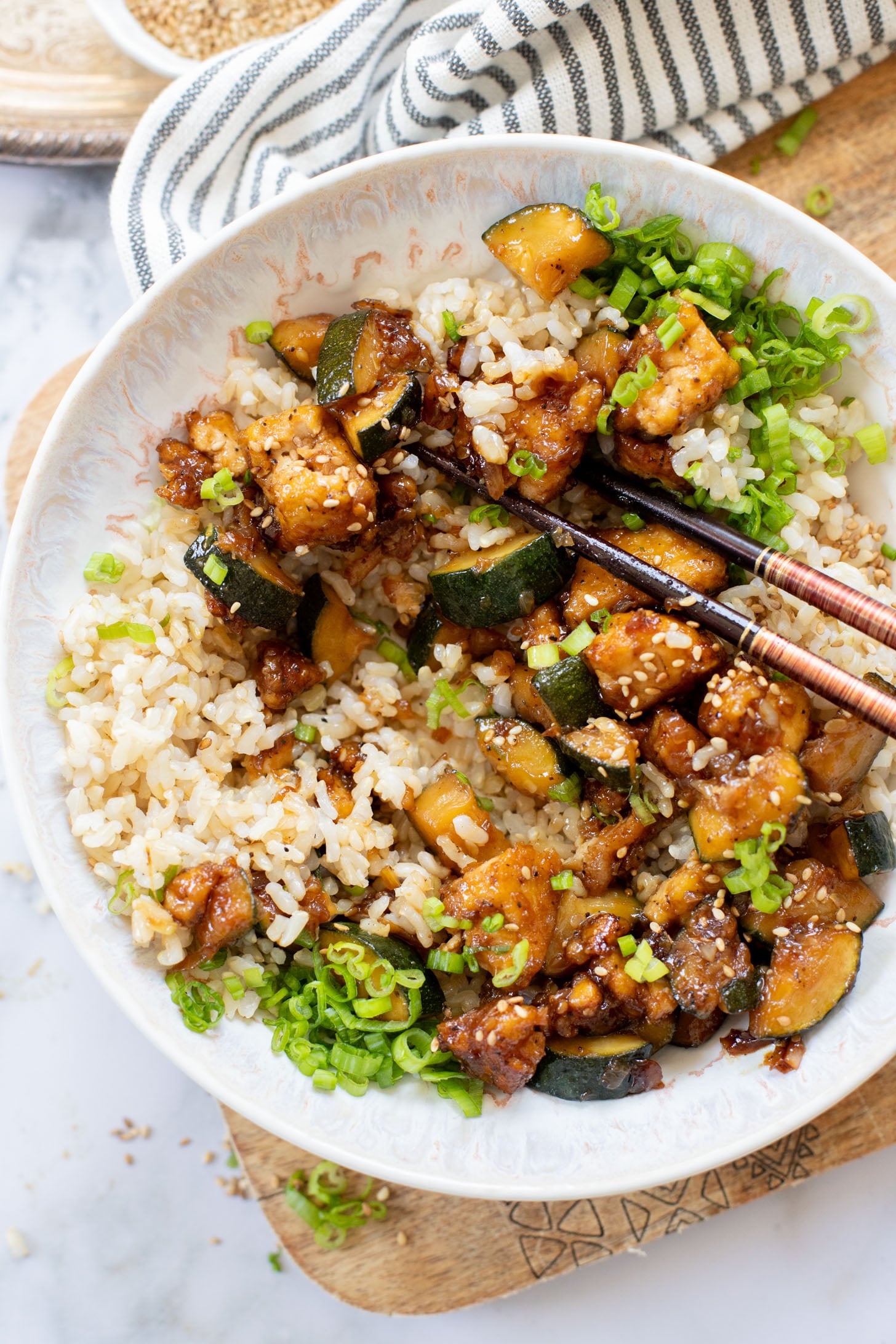 This Zucchini & Tofu Stir Fry is the perfect summer one-pot vegan dinner! Made with simple ingredients in a pre-made Soyaki sauce | ThisSavoryVegan.com