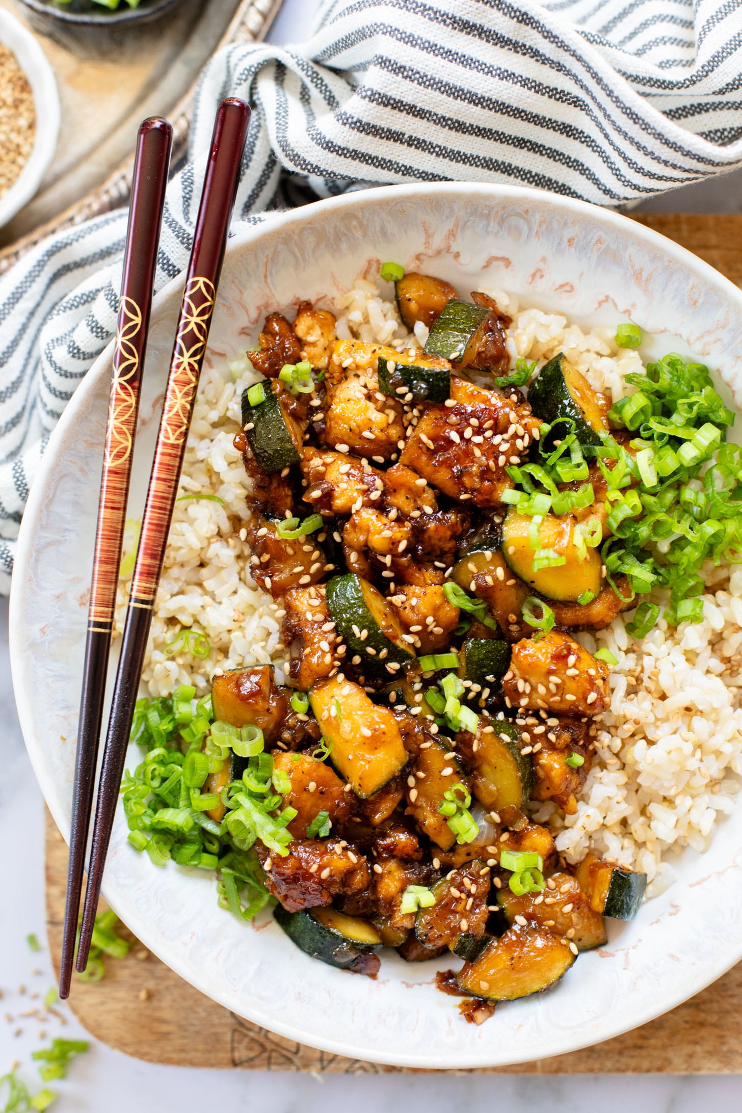 This Zucchini & Tofu Stir Fry is the perfect summer one-pot vegan dinner! Made with simple ingredients in a pre-made Soyaki sauce | ThisSavoryVegan.com