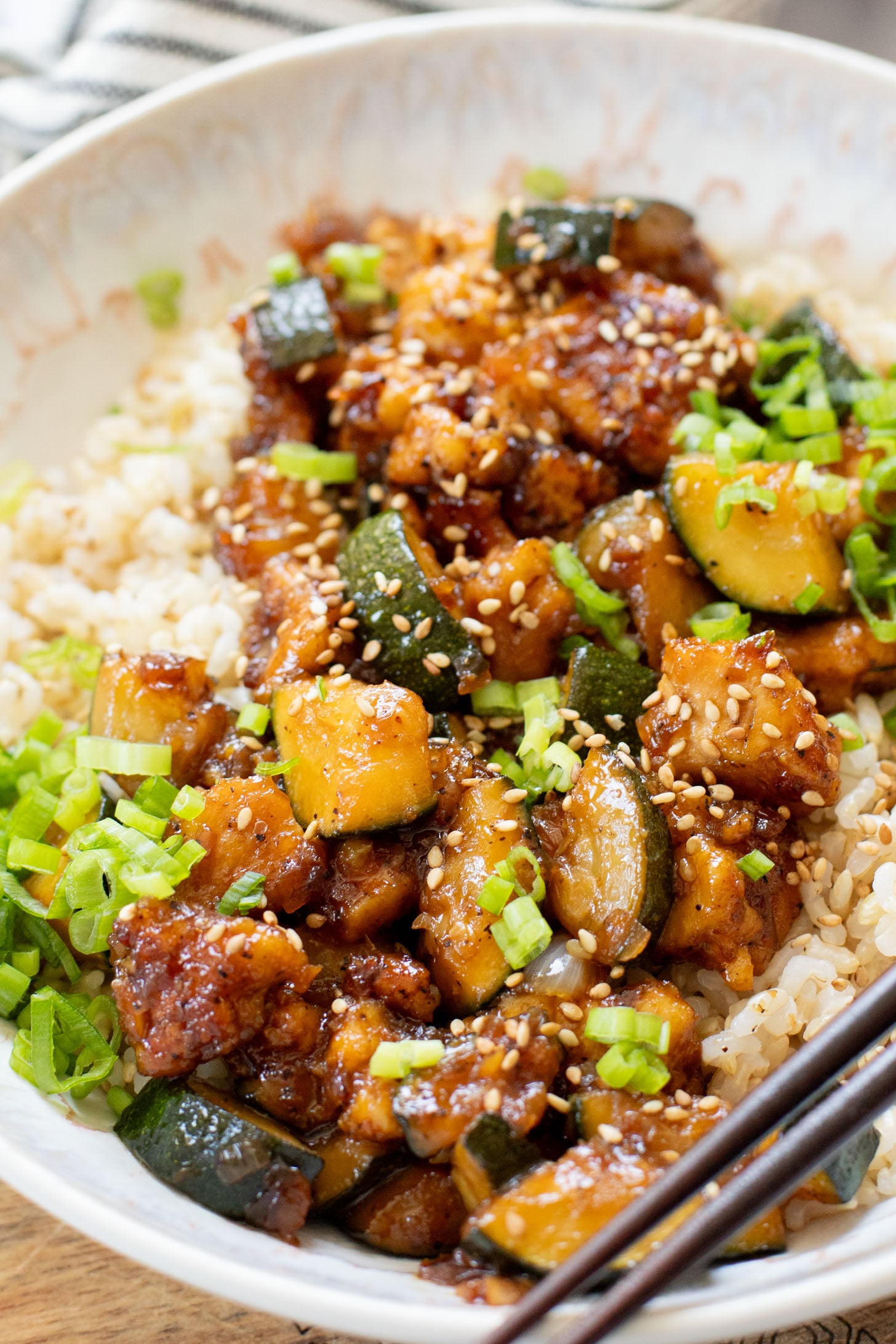 This Zucchini & Tofu Stir Fry is the perfect summer one-pot vegan dinner! Made with simple ingredients in a pre-made Soyaki sauce | ThisSavoryVegan.com