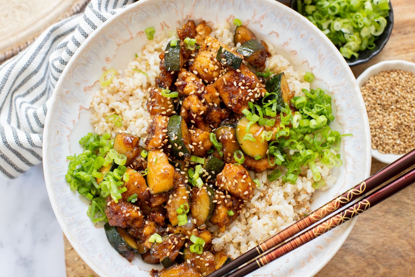 This Zucchini & Tofu Stir Fry is the perfect summer one-pot vegan dinner! Made with simple ingredients in a pre-made Soyaki sauce | ThisSavoryVegan.com